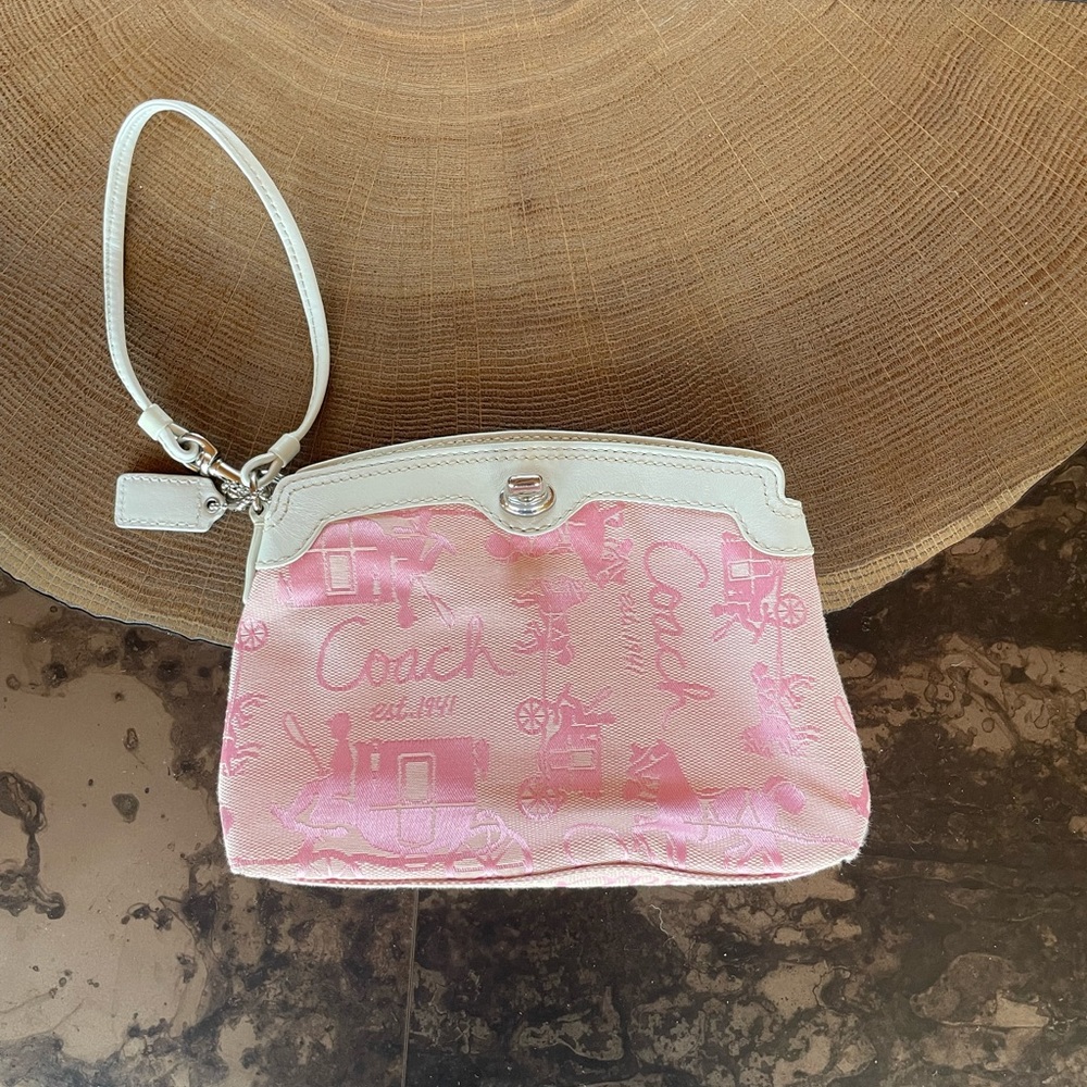 Pink Coach wristlet with white leather trim
